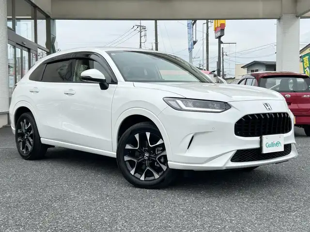 ホンダ ＺＲ－Ｖ ハイブリッド e:HEV Z 埼玉県 2025(令7)年 0.2万km パール ・ワンオーナー/新車1か月点検（5月26日）　6か月点検（9月28日）/・Honda SENSING/・前後ドライブレコーダー/・後退出庫サポート/・アダプティブドライビングビーム/・マルチビューカメラシステム/・Honda CONNECTディスプレー（TVキャンセラー）/・＋ETC2.0車載器＋ワイヤレス充電器/・本革シート＋運転席8ウェイ助手席4ウェイパワーシート/・ドライビングポジションシステム付/・運転席＆助手席シートヒーター/・BOSEプレミアムサウンドシステム(12スピーカー)/・ハンズフリーアクセスパワーテールゲート/(予約クローズ機能付)/・18インチアルミホイール(切削＋ベルリナブラック)/・ステアリングヒーター/・レーダークルーズコントロール/・イルミネーションスカッフプレート/・電子パキングブレーキ/・オートホールド/・オートライト/・LEDヘットライト/・BSM/・コーナーセンサー/・保証書/・取説/・スマートキー×２/・プレミアムグラスコーティング新車時施工メンテナンスキット車載