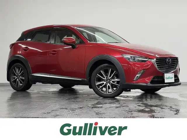 マツダ ＣＸ－３ XD ツーリング Lパッケージ 三重県 2015(平27)年 6万km ソウルレッドプレミアムメタリック 1.5L ディーゼルターボ/4WD/MTモード付フロア6AT/純正 7インチナビ/（FM/AM/aha/Stitcher/Bluetooth/USB/【OP】CD/AUX/DVD/TV）/バックカメラ/BOSEサウンドシステム＋7スピーカー/ドライブレコーダー 前方/ETC/安全/・スマートシティブレーキサポート（SCBS）/・スマートブレーキサポート（SBS）/・車線逸脱警報システム（LDWS）/・マツダレーダークルーズコントロール（MRCC）/・ブラインドスポットモニタリング（BSM：リヤクロストラフィックアラート機能付）/・車間認知支援システム/・ハイビームコントロールシステム（HBC）/装備/・ハーフレザーシート/・シートヒーター（D/N）/・オートエアコン/・オートライト/・LED ヘッドライト＆フロントフォグライト/・レインセンサーワイパー（オートフロントワイパー）/・パドルシフト/・ステアリングスイッチ/・プッシュスタート/・純正18inAW/・保/・予備スマートキーx1、リモコンエンジンスターターx1/など