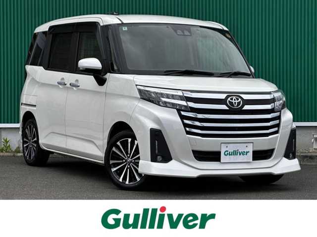 トヨタ ルーミー カスタムG－T 宮城県 2022(令4)年 3.7万km パールホワイトⅢ パノラミックビュー対応ナビレディパッケージ/・ステアリングスイッチ/・パノラミックビューモニター/コンフォートパッケージ/・シートヒーター/・シートバックテーブル/＝＝＝/スマートアシスト/・衝突警報機能/・衝突回避支援ブレーキ機能/・ブレーキ制御付誤発進抑制機能/・先行車発進お知らせ機能/・アダプティブドライビングビーム/・アダプティブクルーズコントロール/・ふらつき警報/・サイドビューランプ/・コーナーセンサー/・路側逸脱警報/・標識認識機能/純正9インチナビ（NSZT-Y68T）/・CD/DVD/・Bluetooth/フルセグTV/ビルトインETC2.0/ドライブレコーダー/両側電動スライドドア/革巻きステアリング/電動パーキングブレーキ/ブレーキホールド/LEDヘッドランプ/フォグランプ/オートライ/スマートキー＆プッシュスタート/電動格納ミラー/純正15インチAW/純正フロアマット/純正ドアバイザー/Wエアバッグ