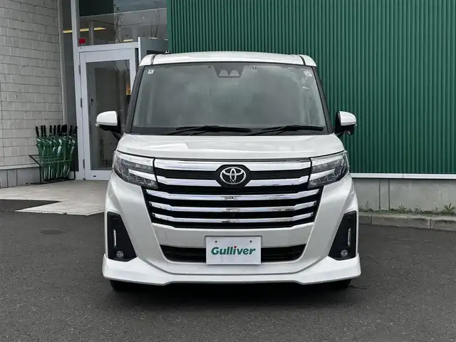 トヨタ ルーミー カスタムG－T 宮城県 2022(令4)年 3.7万km パールホワイトⅢ パノラミックビュー対応ナビレディパッケージ/・ステアリングスイッチ/・パノラミックビューモニター/コンフォートパッケージ/・シートヒーター/・シートバックテーブル/＝＝＝/スマートアシスト/・衝突警報機能/・衝突回避支援ブレーキ機能/・ブレーキ制御付誤発進抑制機能/・先行車発進お知らせ機能/・アダプティブドライビングビーム/・アダプティブクルーズコントロール/・ふらつき警報/・サイドビューランプ/・コーナーセンサー/・路側逸脱警報/・標識認識機能/純正9インチナビ（NSZT-Y68T）/・CD/DVD/・Bluetooth/フルセグTV/ビルトインETC2.0/ドライブレコーダー/両側電動スライドドア/革巻きステアリング/電動パーキングブレーキ/ブレーキホールド/LEDヘッドランプ/フォグランプ/オートライ/スマートキー＆プッシュスタート/電動格納ミラー/純正15インチAW/純正フロアマット/純正ドアバイザー/Wエアバッグ