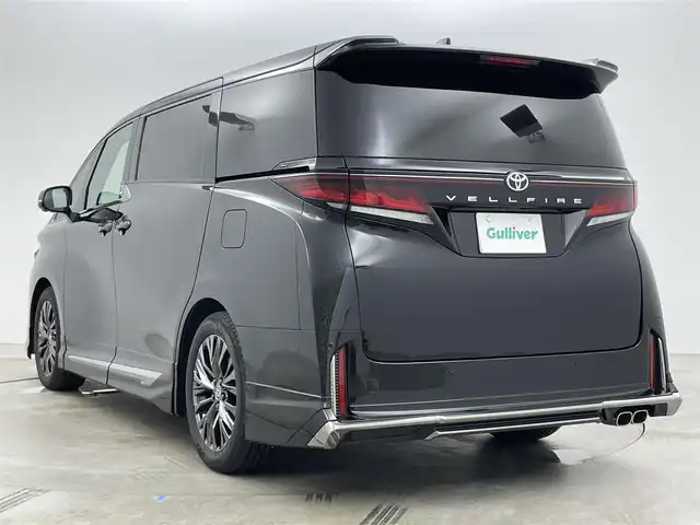 トヨタ ヴェルファイア Z プレミア 岡山県 2025(令7)年 0.4万km ブラック モデリスタエアロ/純正13インチフリップダウンモニター/寒冷地仕様/・リアLEDフォグランプ/・ウインドシールドデアイサー/・エンブレムヒーター/スペアタイヤ/HDMI入力端子（センターコンソールBOX内）/サンセットブラウンプレミアムナッパ本革/左右独立ムーンルーフ /純正14インチディスプレイオーディオ/コネクティッドナビ対応/HDMI/地デジ/USB//Bluetooth/AppleCarPlay/Androidauto/ETC2.0/パノラミックビューモニター/アクセサリーコンセントAC100V/トヨタセーフティセンス /・プリクラッシュセーフティ/・緊急時操蛇支援/・レーントレーシングアシスト/・レーダークルーズコントロール/・アダプティブハイビーム/ブラインドスポットモニター/前後方ドライブレコーダー（ディスプレイ内蔵）/トヨタチームメイト/・アドバンストパーク/・アドバンストドライブ/カラーヘッドアップディスプレイ/三眼LEDヘッドランプ/デジタルインナーミラー/パワーバックドア/エグゼクティブパワーシート /快適温熱シート/ベンチレーション/両側パワースライドドア