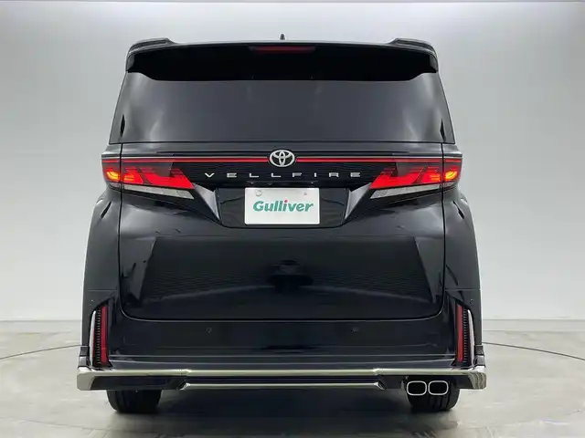 トヨタ ヴェルファイア Z プレミア 岡山県 2025(令7)年 0.4万km ブラック モデリスタエアロ/純正13インチフリップダウンモニター/寒冷地仕様/・リアLEDフォグランプ/・ウインドシールドデアイサー/・エンブレムヒーター/スペアタイヤ/HDMI入力端子（センターコンソールBOX内）/サンセットブラウンプレミアムナッパ本革/左右独立ムーンルーフ /純正14インチディスプレイオーディオ/コネクティッドナビ対応/HDMI/地デジ/USB//Bluetooth/AppleCarPlay/Androidauto/ETC2.0/パノラミックビューモニター/アクセサリーコンセントAC100V/トヨタセーフティセンス /・プリクラッシュセーフティ/・緊急時操蛇支援/・レーントレーシングアシスト/・レーダークルーズコントロール/・アダプティブハイビーム/ブラインドスポットモニター/前後方ドライブレコーダー（ディスプレイ内蔵）/トヨタチームメイト/・アドバンストパーク/・アドバンストドライブ/カラーヘッドアップディスプレイ/三眼LEDヘッドランプ/デジタルインナーミラー/パワーバックドア/エグゼクティブパワーシート /快適温熱シート/ベンチレーション/両側パワースライドドア