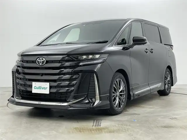 トヨタ ヴェルファイア Z プレミア 岡山県 2025(令7)年 0.4万km ブラック モデリスタエアロ/純正13インチフリップダウンモニター/寒冷地仕様/・リアLEDフォグランプ/・ウインドシールドデアイサー/・エンブレムヒーター/スペアタイヤ/HDMI入力端子（センターコンソールBOX内）/サンセットブラウンプレミアムナッパ本革/左右独立ムーンルーフ /純正14インチディスプレイオーディオ/コネクティッドナビ対応/HDMI/地デジ/USB//Bluetooth/AppleCarPlay/Androidauto/ETC2.0/パノラミックビューモニター/アクセサリーコンセントAC100V/トヨタセーフティセンス /・プリクラッシュセーフティ/・緊急時操蛇支援/・レーントレーシングアシスト/・レーダークルーズコントロール/・アダプティブハイビーム/ブラインドスポットモニター/前後方ドライブレコーダー（ディスプレイ内蔵）/トヨタチームメイト/・アドバンストパーク/・アドバンストドライブ/カラーヘッドアップディスプレイ/三眼LEDヘッドランプ/デジタルインナーミラー/パワーバックドア/エグゼクティブパワーシート /快適温熱シート/ベンチレーション/両側パワースライドドア