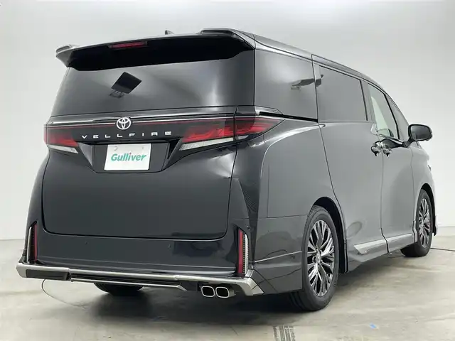 トヨタ ヴェルファイア Z プレミア 岡山県 2025(令7)年 0.4万km ブラック モデリスタエアロ/純正13インチフリップダウンモニター/寒冷地仕様/・リアLEDフォグランプ/・ウインドシールドデアイサー/・エンブレムヒーター/スペアタイヤ/HDMI入力端子（センターコンソールBOX内）/サンセットブラウンプレミアムナッパ本革/左右独立ムーンルーフ /純正14インチディスプレイオーディオ/コネクティッドナビ対応/HDMI/地デジ/USB//Bluetooth/AppleCarPlay/Androidauto/ETC2.0/パノラミックビューモニター/アクセサリーコンセントAC100V/トヨタセーフティセンス /・プリクラッシュセーフティ/・緊急時操蛇支援/・レーントレーシングアシスト/・レーダークルーズコントロール/・アダプティブハイビーム/ブラインドスポットモニター/前後方ドライブレコーダー（ディスプレイ内蔵）/トヨタチームメイト/・アドバンストパーク/・アドバンストドライブ/カラーヘッドアップディスプレイ/三眼LEDヘッドランプ/デジタルインナーミラー/パワーバックドア/エグゼクティブパワーシート /快適温熱シート/ベンチレーション/両側パワースライドドア
