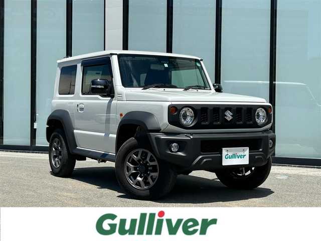 スズキ ジムニー シエラ JC 大阪府 2023(令5)年 1.8万km ピュアホワイトP 社外９インチナビ（アルパイン製）　/ビルトインＥＴＣ2.0　/バックカメラ　/前後ドライブレコーダー　/純正フロアマット　/クルーズコントロール　/シートヒーター　/純正１５インチアルミホイール　/デュアルセンサーブレーキサポート/HDMI接続/背面スペアタイヤ/LEDヘッドライト/ワンオーナー