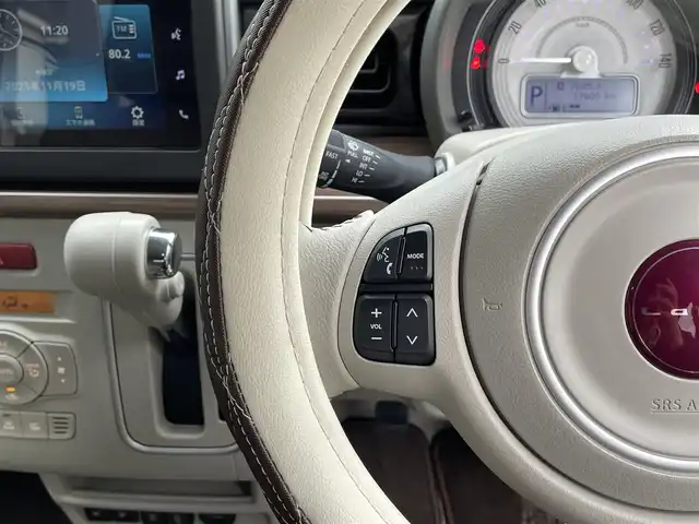 スズキ ラパン ＬＣ X 滋賀県 2024(令6)年 1.8万km フォーンベージュメタリック/アーバンブラウン 2トーン 純正7インチディスプレイオーディオ/【Bluetooth/USB】/バックカメラ/リアソナー/レーンキープアシスト/衝突軽減ブレーキ/LEDヘッドライト/オートマチックハイビーム/純正フロアマット/ビルトインETC/D/Nシートヒーター/プッシュスタート/スマートキー/ステアリングリモコン