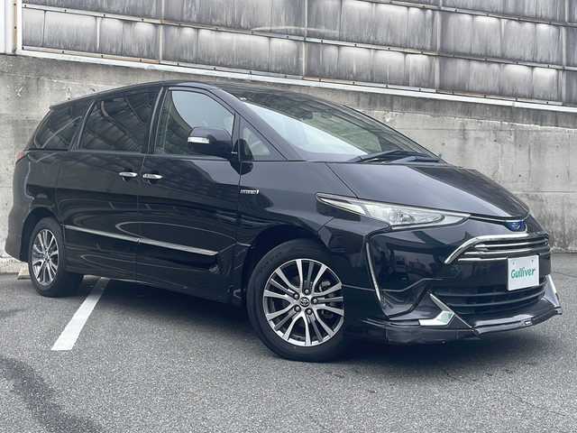 トヨタ エスティマ ハイブリッド アエラス 愛知県 2017(平29)年 5.9万km ブラック ワンオーナー/モデリスタフロントエアロ/純正SDナビ/フルセグTV・Bluetooth・DVD・CD・FM・AM/バックカメラ/純正後席フリップダウンモニター/運転席パワーシート/両側パワースライドドア/プリクラッシュセーフティ/レーダークルーズコントロール/LDA/クリアランスソナー/オートハイビーム/ビルトインETC/2列目オットマンシート/LEDヘッドライト/社外前後ドライブレコーダー(コムテック ZDR-015)/ステアリングスイッチ/ナノイーエアコン/スマートキー/プッシュスタート/純正フロアマット/保証書/取扱説明書/スペアスマートキー