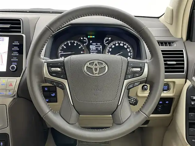 トヨタ ランドクルーザー プラド TX Lパッケージ マットブラED 愛知県 2023(令5)年 2万km ホワイトパールクリスタルシャイン 純正９型ＤＡナビ　ムーンルーフ　全方位カメラ　ベンチレーション　ＥＴＣ２．０　ドラレコ　シートヒーター　セーフティセンス　衝突軽減　追従クルコン　ＬＥＤオートライト　ＢＳＭ　ベージュ革　フォグランプ