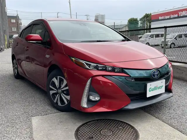 トヨタ プリウス ＰＨＶ A 千葉県 2017(平29)年 2.3万km エモーショナルレッド 純正11.6型縦型ナビ、フルセグTV/バックカメラ/トヨタセーフティセンス/純正LEDヘッドライト&LEDフォグ/純正15インチアルミホイール/ウィンカードアミラー/ステアリングヒーター/アダプティブクルーズコントロール/ブラインドスポットモニター/前席シートヒーター/オートライト/横滑り防止機能/ビルトインETC/充電器ケーブル付き/新車整備手帳/取扱説明書/スペアキー