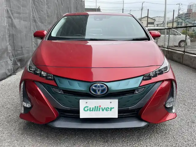 トヨタ プリウス ＰＨＶ A 千葉県 2017(平29)年 2.3万km エモーショナルレッド 純正11.6型縦型ナビ、フルセグTV/バックカメラ/トヨタセーフティセンス/純正LEDヘッドライト&LEDフォグ/純正15インチアルミホイール/ウィンカードアミラー/ステアリングヒーター/アダプティブクルーズコントロール/ブラインドスポットモニター/前席シートヒーター/オートライト/横滑り防止機能/ビルトインETC/充電器ケーブル付き/新車整備手帳/取扱説明書/スペアキー