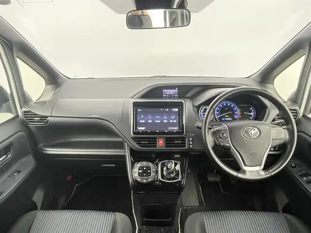 トヨタ ヴォクシー ハイブリッド ZS 煌Ⅱ 千葉県 2016(平28)年 6.5万km ホワイトパールクリスタルシャイン 禁煙車/純正9インチメモリナビ/　CD/DVD/BT/フルセグTV/両側パワースライドドア/トヨタセーフティセンス/・プリクラッシュセーフティ/・レーンディパーチャーアラート/・オートマチックハイビーム/・先行車発進お知らせ機能/バックカメラ/ETC/スマートキー&プッシュスタート/ステアリングスイッチ/革巻きステアリング/LEDヘッドライト/純正16インチアルミホイール