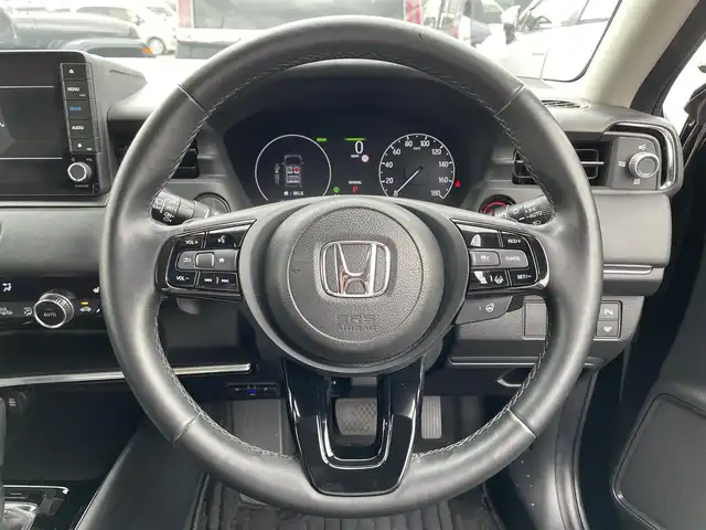 ホンダ ヴェゼル ハイブリッド e:HEV Z 滋賀県 2023(令5)年 1.9万km クリスタルブラックパール 純正９インチナビ/・CD・DVD・Bluetooth・フルセグTV/バックカメラ/ブラインドスポットモニター/ステアリングヒーター/シートヒーター/電動リアゲート/ＬＥＤヘッドライト/ダウンヒルコントロール/前後コーナーセンサー/前後ドラレコ/追従クルーズコントロール/ステアリングヒーター/オートライト/レーンキープアシスト/衝突軽減/横滑り防止/盗難防止/純正18インチAW/スマートキー