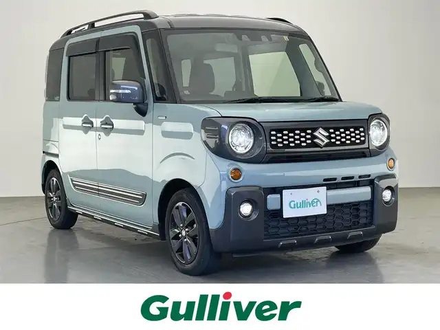 スズキ スペーシア ギア HYBRID XZターボ 愛知県 2022(令4)年 4.8万km オフブルーメタリック/ガンメタリック2トーンルーフ 純正ディスプレイ　ＤＶＤ　Ｂｌｕｅｔｏｏｔｈ　ＵＳＢ　バックカメラ　シートヒーター　両側パワースライドドア　ＬＥＤライト　フォグ　衝突軽減　追従クルコン　デュアルカメラブレーキ　純正１４インチアルミホイール　パドルシフト　ルーフレール　リヤパーキングセンサー　リアシェード　背面テーブル　禁煙車