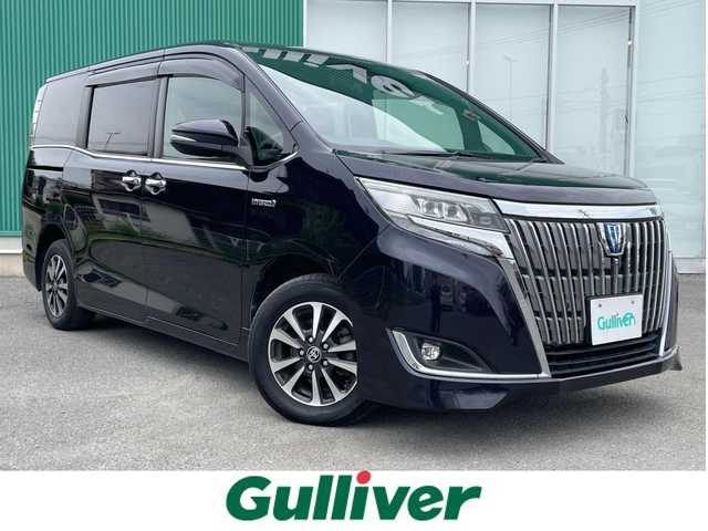 トヨタ エスクァイア ハイブリッド Gi プレミアムパッケージ 福岡県 2019(令1)年 6.3万km スパークリングブラックパールクリスタルシャイン レーンキープアシスト/盗難防止システム/衝突被害軽減システム/ドラレコ前後/車外カメラ/追従式クルコン/BT/9インチフルセグTV/純正フリップダウンモニター/ビルトインETC/純正AW/純正フロアマット/TRC/走行切替/サイドカーテン/Dualエアコン/ステアリングヒーター/LEDライト