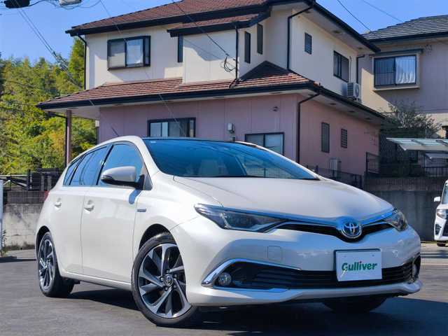 トヨタ オーリスハイブリッド Gパッケージ 熊本県 2016(平28)年 11.5万km ホワイトパールクリスタルシャイン パノラマルーフ/純正9インチナビ（NSZT-Y64T）/【フルセグTV/Bluetooth/CD/DVD】/バックカメラ/クルーズコントロール/プリクラッシュセーフティー/先行車発進お知らせ/レーンキープアシスト/オートLEDライト/ホワイトハーフレザーシート/前席シートヒーター/革巻きステアリング/ステアリングスイッチ/純正１７インチAW/ETC/純正フロアマット/横滑り防止装置/ABS/保証書/取扱説明書/スペアキー