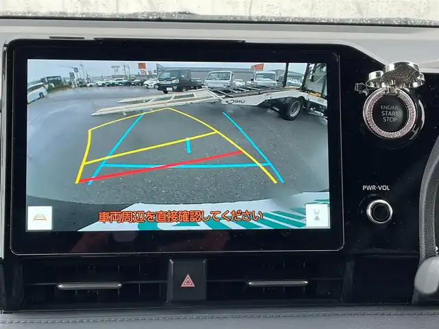 トヨタ ヴォクシー S－Z 滋賀県 2023(令5)年 1.8万km グリッターブラックガラスフレーク 両側パワースライドドア/純正10.5インチナビ/（AM/FM/CD/DVD/フルセグ/Bluetooth/USB）/バックカメラ/前後ドライブレコーダー/ビルトインETC2.0/トヨタセーフティセンス/・踏み間違い防止アシスト/・ブレーキアシスト/・プリクラッシュブレーキアシスト/・ヒルスタート（坂道発進）アシスト/・前方衝突防止支援システム/・TCS（トラクションコントロールシステム）/・VDC（ビークルダイナミクスコントロール）/・レーンキープアシスト/・車間自動制御システム/・ASCD（オートスピードコントロール装置）/・ABS（アンチロックブレーキシステム）/・バックビューモニター/・標識検知機能/電動格納ウインカーミラー/電子パーキング/ブレーキホールド/ステアリングスイッチ/革巻きステアリング/オートライト/オートハイビーム/LEDヘッドライト/フロントフォグ/フルオートエアコン/プッシュスタート/スマートキー/サンシェード/フロアマット