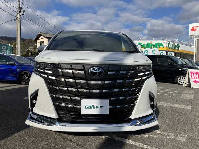 トヨタ アルファードハイブリット Z 広島県 2024(令6)年 0.3万km プラチナホワイトパールマイカ 法人ワンオーナー/モデリスタエアロ/黒革シート/左右独立ムーンルーフ/トヨタチームメイト/左右ユニバーサルステップ/デジタルインナーミラー/純正ナビ/パノラミックビューモニター/純正フリップダウンモニター/カラーヘッドアップディスプレイ/両側パワースライドドア/シートヒーター（全席）/パワーシート（前席・2列目）/ベンチレーションシート（前席）/セーフティセンス/レーダークルーズ/パドルシフト/置くだけ充電/フルセグ・Bluetooth/ブラインドスポットモニタリング/ビルトインETC2.0/電子取扱説明書/新車保証書/スペアキー