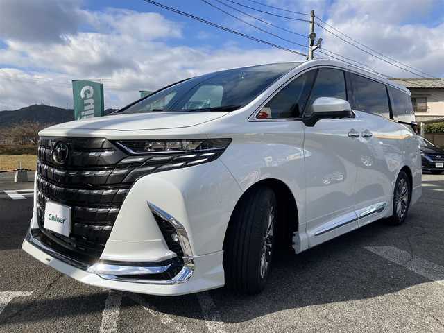 トヨタ アルファードハイブリット Z 広島県 2024(令6)年 0.3万km プラチナホワイトパールマイカ 法人ワンオーナー/モデリスタエアロ/黒革シート/左右独立ムーンルーフ/トヨタチームメイト/左右ユニバーサルステップ/デジタルインナーミラー/純正ナビ/パノラミックビューモニター/純正フリップダウンモニター/カラーヘッドアップディスプレイ/両側パワースライドドア/シートヒーター（全席）/パワーシート（前席・2列目）/ベンチレーションシート（前席）/セーフティセンス/レーダークルーズ/パドルシフト/置くだけ充電/フルセグ・Bluetooth/ブラインドスポットモニタリング/ビルトインETC2.0/電子取扱説明書/新車保証書/スペアキー