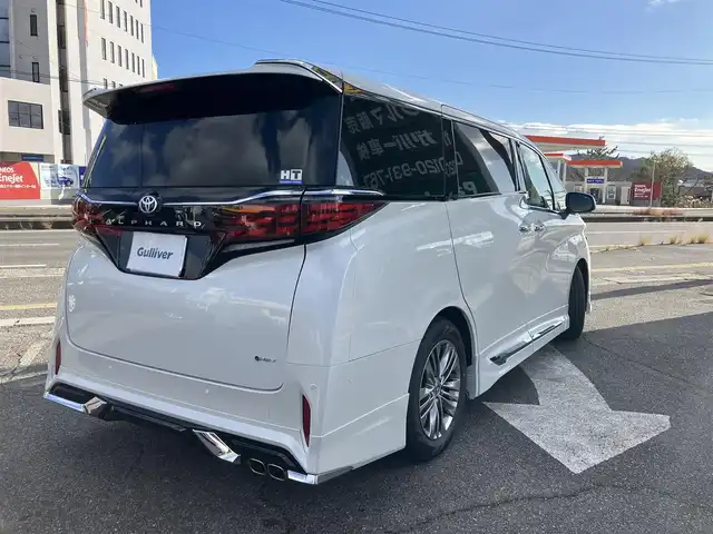 トヨタ アルファードハイブリット Z 広島県 2024(令6)年 0.3万km プラチナホワイトパールマイカ 法人ワンオーナー/モデリスタエアロ/黒革シート/左右独立ムーンルーフ/トヨタチームメイト/左右ユニバーサルステップ/デジタルインナーミラー/純正ナビ/パノラミックビューモニター/純正フリップダウンモニター/カラーヘッドアップディスプレイ/両側パワースライドドア/シートヒーター（全席）/パワーシート（前席・2列目）/ベンチレーションシート（前席）/セーフティセンス/レーダークルーズ/パドルシフト/置くだけ充電/フルセグ・Bluetooth/ブラインドスポットモニタリング/ビルトインETC2.0/電子取扱説明書/新車保証書/スペアキー