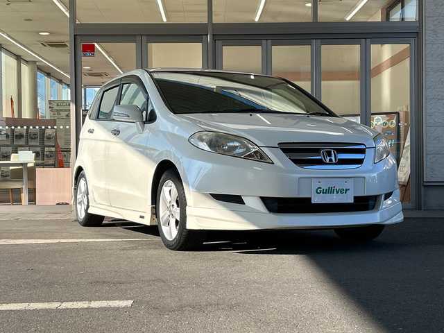 ホンダ エディックス 20X 埼玉県 2005(平17)年 7.1万km プレミアムホワイトパール ワンオーナー/Moduloエアロ(フロント、サイド、リア)/純正HDDナビゲーション(VXH-052CV)/　　CD/DVD/フルセグ/SRSエアバック（運転席、助手席）/Gコントロール技術/3点式ELR/ALRシートベルト/純正16インチアルミホイール/ブレーキアシスト/セキュリティアラーム、イモビライザー/オートエアコン/純正フロアマット/ETC/取扱説明書/保証書/記録簿/スペアキー/禁煙車