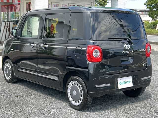 ダイハツ ムーヴ キャンバス セオリー G ターボ 千葉県 2022(令4)年 1.6万km ブラックマイカメタリック ナビNMZK-W72W　バックカメラ　衝突軽減ブレーキ　ＥＴＣ　両側パワースライドドア　シートヒーター　　クルコン　ホッとカップホルダー　タッチ＆ゴーロック機能　ＬＥＤ　オートライト　　ターボ/純正ナビ（NMZK-W72D)/CD/DVD/フルセグTV/Bluetooth/USB/SD/AM/FM/バックカメラ /スマートアシスト/・衝突回避支援ブレーキ/・衝突警報機能/・ブレーキ制御付誤発進抑制機能/・車線逸脱抑制制御/警報機能/・路側逸脱警報機能/・ふらつき警報/・先行車発進お知らせ機能/・標識認識機能/・オートハイビーム/・アダブティブドライビングビーム/・サイドビューランプ/クルーズコントロール/コーナーセンサー/ホッとカップホルダー/両側パワースライドドア /タッチ&ゴーロック機能/シートヒーター /革巻きステアリング/ステアリングリモコン/ステアリングチルド機構/純正フロアマット/LEDフォグ（メッキガーニッシュ付）/ドアアウターハンドル（メッキ）/メッキ調ピンストライプ/メッキサイドガーニッシュ/メッキリアバンパーモール