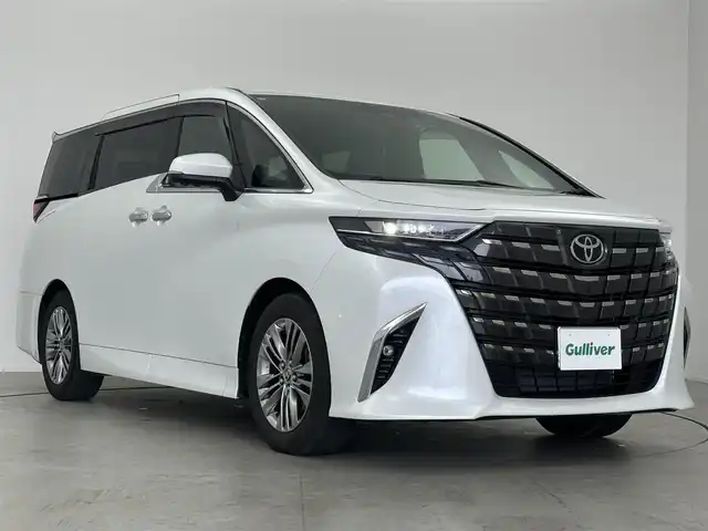 トヨタ アルファードハイブリット Z 愛知県 2023(令5)年 2.1万km プラチナホワイトパールマイカ 14インチディスプレイオーディオ　/（フルセグ/Bluetooth）/12.1インチフリップダウン　/レーダークルーズコントロール　/パノラミックビューモニター　/ブラインドスポットモニター　/コーナーセンサー/衝突軽減システム/レーンキープアアシスト/両側パワースライドドア　/電動リアゲート　/レザーシート　/全席パワーシート　/運転席メモリーシート/全席エアーシート/全席シートヒーター　/ワイヤレス充電/ETC2.0/ドライブレコーダー/純正AW
