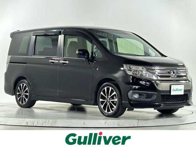 ホンダ ステップワゴン スパーダ Z クールスピリット 佐賀県 2015(平27)年 5.5万km プレミアムスパークルブラックパール 純正９インチナビ【VXM-155VFNi】/（フルセグTV/CD/DVD/BT/AM・FM）/アルパイン製１１．４インチフリップダウンモニター/前後ドライブレコーダー/バックカメラ/両側パワースライドドア/ハーフレザーシート/革巻きステアリング/クルーズコントロール/オートライト/フォグライト/パドルシフト/前席ウォークスルー/３列目床下格納シート/純正１７インチアルミホイール/純正フロアマット/ビルトインＥＴＣ/ウインカーミラー
