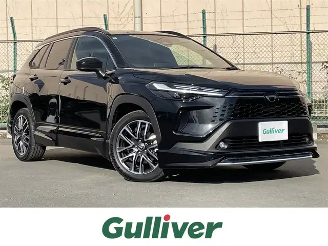 トヨタ カローラ クロス ハイブリッド Z 東京都 2025(令7)年 0.3万km ブラックマイカ ユーザー買取車/純正ナビ/＜フルセグ/AM/FM/BT/Miracast/USB入力端子＞/全周囲カメラ/追従クルコン/ビルトインＥＴＣ２．０/ＬＤＡ/ＢＳＭ/ＰＣＳ/ＰＤＡ/アドバンストパーク/パーキングセンサー/ドライブモード/パワーバックドア/ステアリングヒーター/シートベンチレーション/パワーシート/純正フルエアロ（モデリスタ）/純正AW/純正フロアマット/ヘッドライトレベライザー