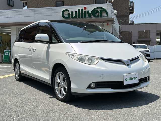 トヨタ エスティマ G 大阪府 2006(平18)年 1.8万km ホワイトパールクリスタルシャイン ワンオーナー/純正ナビ、バックカメラ/純正アルミホイール/ETC/サンルーフ/パノラマルーフ/クルーズコントロール/リラックスキャプテンシート/オットマン/プッシュスタート/アダプティブ・フロントライティング・システム/D席パワーシート/イージークローザードア/電動格納ミラー/ウインカーミラー/クリアランスソナー/プラズマクラスターイオン/パワーウィンドウ/シガーライター