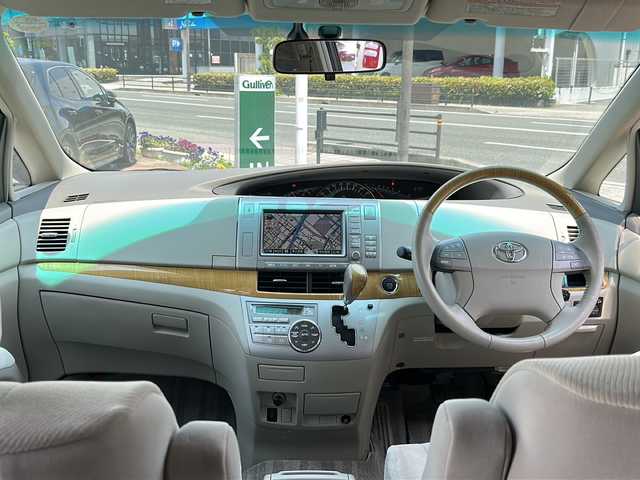 トヨタ エスティマ G 大阪府 2006(平18)年 1.8万km ホワイトパールクリスタルシャイン ワンオーナー/純正ナビ、バックカメラ/純正アルミホイール/ETC/サンルーフ/パノラマルーフ/クルーズコントロール/リラックスキャプテンシート/オットマン/プッシュスタート/アダプティブ・フロントライティング・システム/D席パワーシート/イージークローザードア/電動格納ミラー/ウインカーミラー/クリアランスソナー/プラズマクラスターイオン/パワーウィンドウ/シガーライター