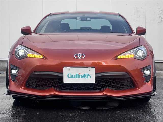 トヨタ ８６ GT 三重県 2016(平28)年 8.9万km オレンジメタリック 6MT/GRフロントポイラー/サイドスカート/TRDエアロスタビライジングカバー/純正ナビ(Bluetooth/CD/DVD/SD/地デジTV/AM/FM)/バックカメラ/ETC/クルーズコントロール/トルセンLSD/LEDクリアランス付LEDヘッドランプ/オートライト/LEDフロントフォグランプ/ダブルステッチ入上級ファブリックシート/左右独立温度調整オートエアコン/スマートエントリー/スタートシステム