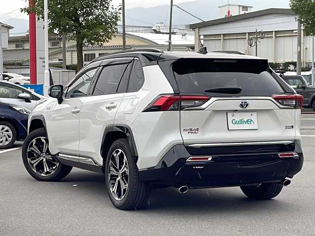 トヨタ ＲＡＶ４ ＰＨＶ ブラックトーン 長野県 2021(令3)年 2.1万km アティチュードブラックマイカ/ホワイトパールクリスタルシャイン ワンオーナー　/４ＷＤ　/フルセグTV　/Bluetooth/ステアリングスイッチ/純正19インチアルミホイール/純正AW付スタッドレス車載/追従クルーズコントロール　/アイドリングストップ　/前後ドラレコ　/プッシュスタート　/プラグインＨＶ　/ＭＴモード付ＡＴ　/寒冷地仕様　/100Ｖ充電　/全方位カメラ/ビルトインETC/電動リアゲート/純正フロアマット/シートヒーター/エアシート/純正フルエアロ/純正アルミ/ステアリングヒーター/社外本革シートカバー/衝突被害軽減装置/レーンキープアシスト/LEDライト/コーナーセンサー/ルーフレール