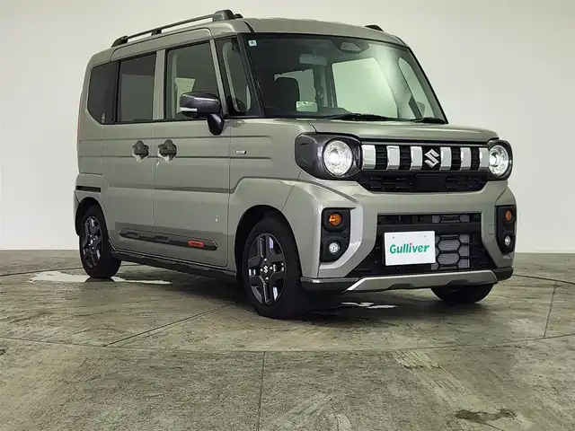 スズキ スペーシア ギア HYBRID XZターボ 愛知県 2024(令6)年 0.2万km モスグレーメタリック 純正9型ナビ（フルセグ、AppleCarplay、Bluetooth）/全方位カメラ/HUD/両側パワスラドア/ACC/電子パーキング/オートホールド/衝突軽減ブレーキ/レーンキープアシスト/LEDヘッドライト/オートハイビーム/シートヒーター（D+N)/ハンドルヒーター/ターボ/スマートキー/オートライト/三点エアバック/フォグライト/電子パーキング/横滑り防止装置