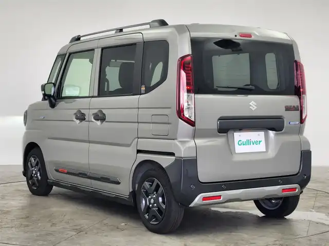 スズキ スペーシア ギア HYBRID XZターボ 愛知県 2024(令6)年 0.2万km モスグレーメタリック 純正9型ナビ（フルセグ、AppleCarplay、Bluetooth）/全方位カメラ/HUD/両側パワスラドア/ACC/電子パーキング/オートホールド/衝突軽減ブレーキ/レーンキープアシスト/LEDヘッドライト/オートハイビーム/シートヒーター（D+N)/ハンドルヒーター/ターボ/スマートキー/オートライト/三点エアバック/フォグライト/電子パーキング/横滑り防止装置