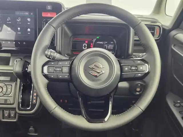 スズキ スペーシア ギア HYBRID XZターボ 愛知県 2024(令6)年 0.2万km モスグレーメタリック 純正9型ナビ（フルセグ、AppleCarplay、Bluetooth）/全方位カメラ/HUD/両側パワスラドア/ACC/電子パーキング/オートホールド/衝突軽減ブレーキ/レーンキープアシスト/LEDヘッドライト/オートハイビーム/シートヒーター（D+N)/ハンドルヒーター/ターボ/スマートキー/オートライト/三点エアバック/フォグライト/電子パーキング/横滑り防止装置