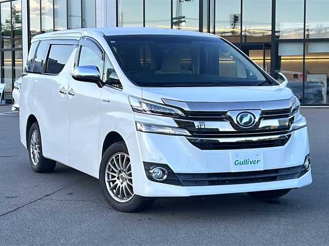 トヨタ ヴェルファイア ハイブリット X 青森県 2015(平27)年 9.1万km ホワイトパールクリスタルシャイン ・純正ナビ/・Bluetooth/・フルセグ/・リアカメラ/・衝突軽減ブレーキ/・クルーズコントロール/・両側パワースライドドア/・ドライブレコーダー/・ETC/・電子制御式パーキングブレーキ/・プッシュスタート/・スマートキー/・オットマン/・社外17AW/・純正LEDヘッドライト