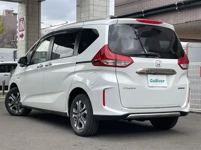 ホンダ フリード ハイブリット クロスター ホンダセンシング 道央・札幌 2021(令3)年 2.1万km プラチナホワイトパール 4WD/純正メモリナビ(フルセグ、FM、AM、CD、DVD、BT、SD)/衝突被害軽減システム/レーダークルーズコントロール/純正フリップダウンモニター/レーンキープアシスト/両側パワースライドドア/バックカメラ/寒冷地仕様/オートライト/シートヒーター(D/N)/純正15インチAW(サマータイヤ)/ルーフレール/社外ドライブレコーダー/ETC/新車時保証書/取扱説明書/スペアキー×1