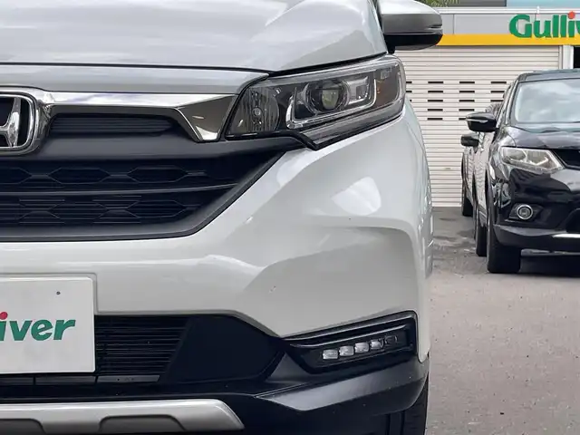 ホンダ フリード ハイブリット クロスター ホンダセンシング 道央・札幌 2021(令3)年 2.1万km プラチナホワイトパール 4WD/純正メモリナビ(フルセグ、FM、AM、CD、DVD、BT、SD)/衝突被害軽減システム/レーダークルーズコントロール/純正フリップダウンモニター/レーンキープアシスト/両側パワースライドドア/バックカメラ/寒冷地仕様/オートライト/シートヒーター(D/N)/純正15インチAW(サマータイヤ)/ルーフレール/社外ドライブレコーダー/ETC/新車時保証書/取扱説明書/スペアキー×1