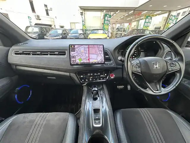 ホンダ ヴェゼル ハイブリッド RS ホンダセンシング 岡山県 2021(令3)年 9.5万km プレミアムクリスタルレッドM 登録時走行距離94277キロ/ワンオーナー/10インチメモリナビ/AM/FM/Bluetooth/TV/SD/DVD/Honda SENSING/・衝突軽減ブレーキ/・アダプティブクルーズコントロール/・路外逸脱抑制機能/アイドリングストップ/バックカメラ/レオニスホイール/LEDヘッドライト/前後ドライブレコーダー/シートヒーター（D＋N）/プッシュスタート/スマートキー/ETC/スペアキー有