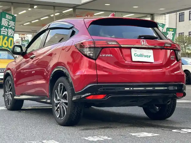 ホンダ ヴェゼル ハイブリッド RS ホンダセンシング 岡山県 2021(令3)年 9.5万km プレミアムクリスタルレッドM 登録時走行距離94277キロ/ワンオーナー/10インチメモリナビ/AM/FM/Bluetooth/TV/SD/DVD/Honda SENSING/・衝突軽減ブレーキ/・アダプティブクルーズコントロール/・路外逸脱抑制機能/アイドリングストップ/バックカメラ/レオニスホイール/LEDヘッドライト/前後ドライブレコーダー/シートヒーター（D＋N）/プッシュスタート/スマートキー/ETC/スペアキー有