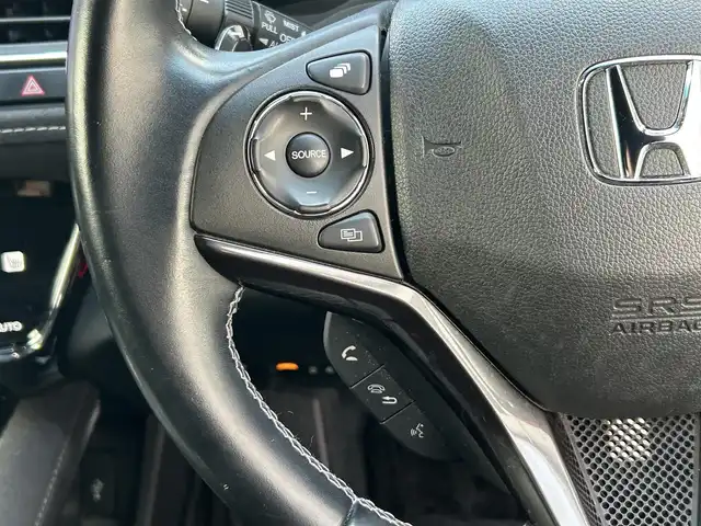 ホンダ ヴェゼル ハイブリッド RS ホンダセンシング 岡山県 2021(令3)年 9.5万km プレミアムクリスタルレッドM 登録時走行距離94277キロ/ワンオーナー/10インチメモリナビ/AM/FM/Bluetooth/TV/SD/DVD/Honda SENSING/・衝突軽減ブレーキ/・アダプティブクルーズコントロール/・路外逸脱抑制機能/アイドリングストップ/バックカメラ/レオニスホイール/LEDヘッドライト/前後ドライブレコーダー/シートヒーター（D＋N）/プッシュスタート/スマートキー/ETC/スペアキー有