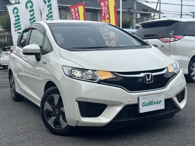 ホンダ フィット ハイブリット Lパッケージ 京都府 2016(平28)年 2.4万km プレミアムホワイトパールⅡ  シティブレーキシステム/ LEDヘッドライト/ 前後コーナーセンサー/ クルーズコントロール/ ホンダスマートキー　スペアキーあり/ プッシュスタート/ ギャザーズナビ/ フルセグ/ BTオーディオ/ CD DVD/ バックカメラ/ 車検R9.9.25/ 登録時走行距離　23946キロ
