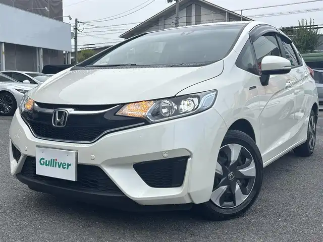 ホンダ フィット ハイブリット Lパッケージ 京都府 2016(平28)年 2.4万km プレミアムホワイトパールⅡ  シティブレーキシステム/ LEDヘッドライト/ 前後コーナーセンサー/ クルーズコントロール/ ホンダスマートキー　スペアキーあり/ プッシュスタート/ ギャザーズナビ/ フルセグ/ BTオーディオ/ CD DVD/ バックカメラ/ 車検R9.9.25/ 登録時走行距離　23946キロ