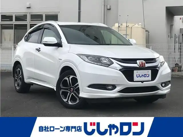 ホンダ ヴェゼル ハイブリッド Z 栃木県 2014(平26)年 10.3万km ホワイトオーキッドパール (株)IDOMが運営する【じしゃロン小山店】の自社ローン対象車両になります。こちらは現金ご利用時の価格です。/自社ローンご希望の方は別途その旨お申付け下さい。//禁煙車/純正フルセグナビ/（CD/DVD/AM/FMラジオ）/(Bluetooth)/スマートキー/プッシュスタート/バックカメラ/ＥＴＣ/クルーズコントロール/シティブレーキアクティブシステム/ルーフレール/シートヒーター/チップアップシート/ステアリングリモコン/電動格納ドアミラー/パワーウインドウ/オートライト/自動防眩ミラー