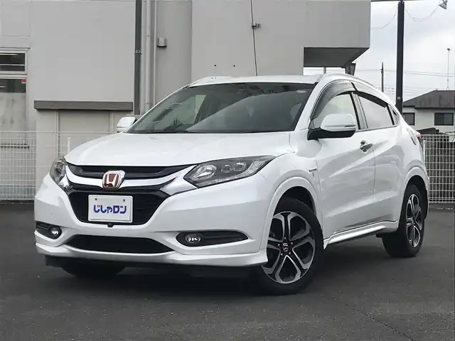 ホンダ ヴェゼル ハイブリッド Z 栃木県 2014(平26)年 10.3万km ホワイトオーキッドパール (株)IDOMが運営する【じしゃロン小山店】の自社ローン対象車両になります。こちらは現金ご利用時の価格です。/自社ローンご希望の方は別途その旨お申付け下さい。//禁煙車/純正フルセグナビ/（CD/DVD/AM/FMラジオ）/(Bluetooth)/スマートキー/プッシュスタート/バックカメラ/ＥＴＣ/クルーズコントロール/シティブレーキアクティブシステム/ルーフレール/シートヒーター/チップアップシート/ステアリングリモコン/電動格納ドアミラー/パワーウインドウ/オートライト/自動防眩ミラー