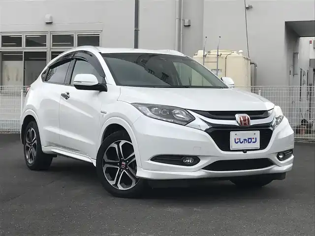 ホンダ ヴェゼル ハイブリッド Z 栃木県 2014(平26)年 10.3万km ホワイトオーキッドパール (株)IDOMが運営する【じしゃロン小山店】の自社ローン対象車両になります。こちらは現金ご利用時の価格です。/自社ローンご希望の方は別途その旨お申付け下さい。//禁煙車/純正フルセグナビ/（CD/DVD/AM/FMラジオ）/(Bluetooth)/スマートキー/プッシュスタート/バックカメラ/ＥＴＣ/クルーズコントロール/シティブレーキアクティブシステム/ルーフレール/シートヒーター/チップアップシート/ステアリングリモコン/電動格納ドアミラー/パワーウインドウ/オートライト/自動防眩ミラー