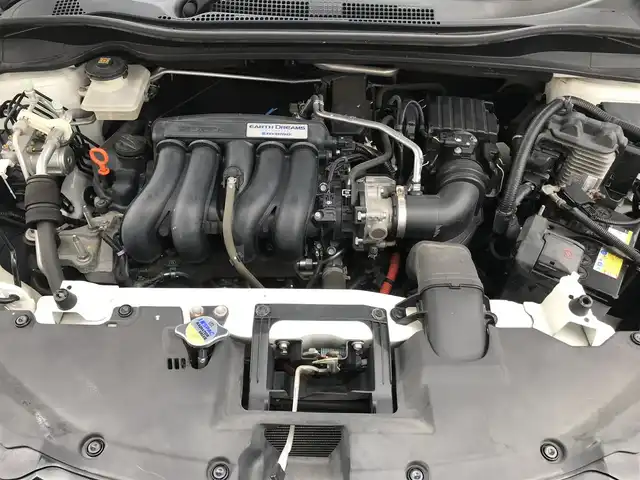 ホンダ ヴェゼル ハイブリッド Z 栃木県 2014(平26)年 10.3万km ホワイトオーキッドパール (株)IDOMが運営する【じしゃロン小山店】の自社ローン対象車両になります。こちらは現金ご利用時の価格です。/自社ローンご希望の方は別途その旨お申付け下さい。//禁煙車/純正フルセグナビ/（CD/DVD/AM/FMラジオ）/(Bluetooth)/スマートキー/プッシュスタート/バックカメラ/ＥＴＣ/クルーズコントロール/シティブレーキアクティブシステム/ルーフレール/シートヒーター/チップアップシート/ステアリングリモコン/電動格納ドアミラー/パワーウインドウ/オートライト/自動防眩ミラー