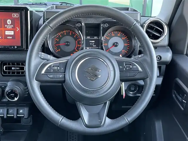 スズキ ジムニー XC 香川県 2023(令5)年 1.5万km ジャングルグリーン 登録時走行距離：15015km/純正ナビ　/ＥＴＣ　/Ｂカメラ　　/４ＷＤ　/純正アルミ　/純正フロアマット　/背面タイヤ　/シートヒーター　/ＬＥＤヘッドライト　/衝突軽減ブレーキ　/横滑り防止　/オートライト　/レーンキープアシスト/スマートキー