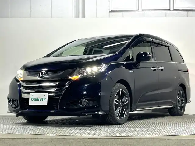 ホンダ オデッセイ ハイブリッド アブソルート ホンダセンシング 大阪府 2016(平28)年 6万km プレミアムヴィーナスブラックP 純正8incナビTV Bカメラ 後席モニター ETC 両側パワースライドドア ハーフレザー パワーシート 衝突軽減 レーダーC レーンアシスト スマートキー