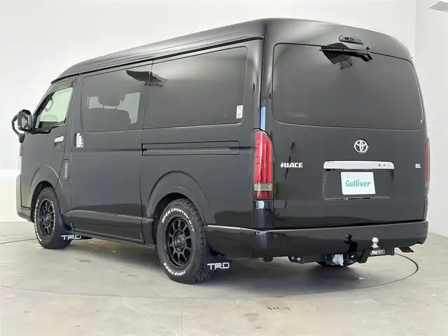 トヨタ ハイエース GL 愛知県 2024(令6)年 1.5万km ブラックマイカ FLEXコンプリートカー/・シートアレンジ【familiar】/・SOREXヒッチメンバー/・防虫MAGネット/・アミエース（左後網戸）/・フロントバンパー/・テールランプ/・白黄切替フォグランプ/・シートカバー/カロッツェリアフローティングナビ/(BT/フルセグ/HDMI)/カロッツェリア後席モニター/全方位カメラ/ETC/ドライブレコーダー/プリクラッシュ/LDA/クリアランスソナー/オートハイビーム/ドアバイザー/NITRO POWER１６インチホイール/TOYOオープンカントリータイヤ/社外シフトノブ